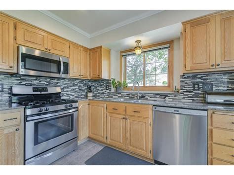 golden oak cabinets and stainless steel appliances|stainless steel oak cabinet.